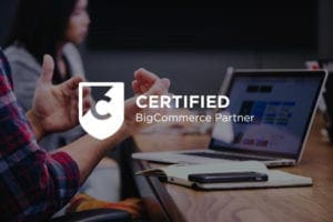 BigCommerce Partner logo with an office as a background