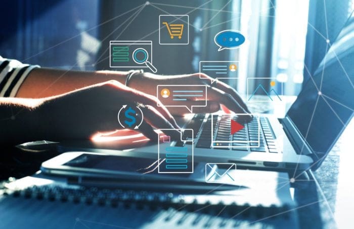 pair of hands using a desktop