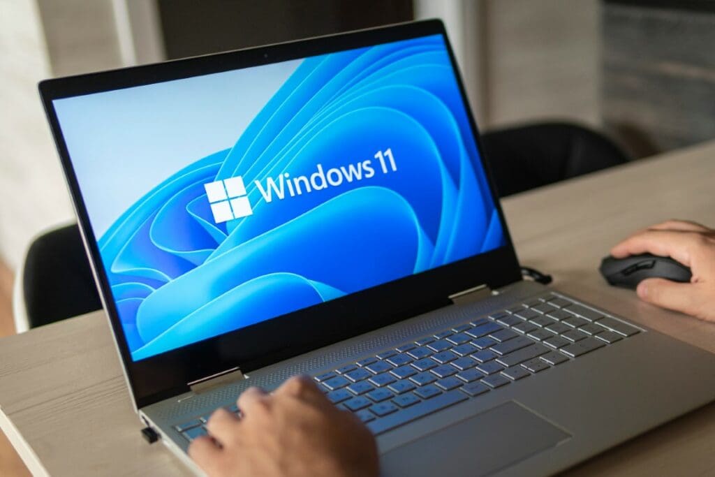 Windows 11 startup screen displayed on a modern laptop, highlighting slow user adoption despite the new operating system release.