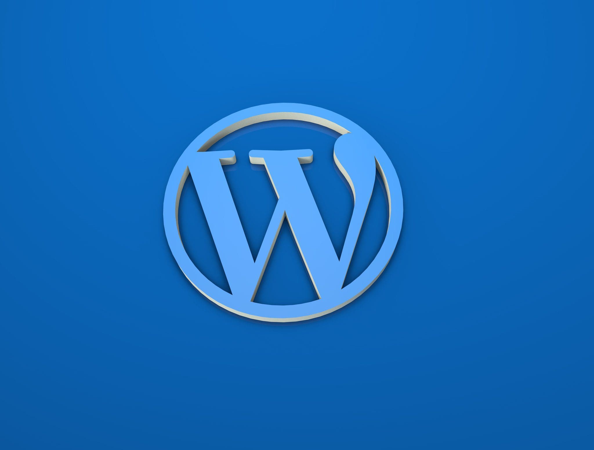 Blue 3D WordPress logo on a solid background representing WordPress update version 6.2.