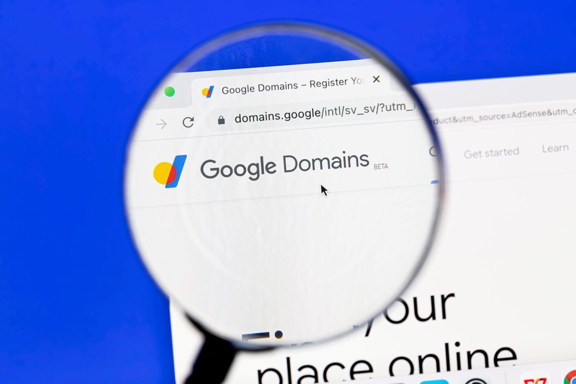 Magnifying glass highlighting Google Domains website in a browser