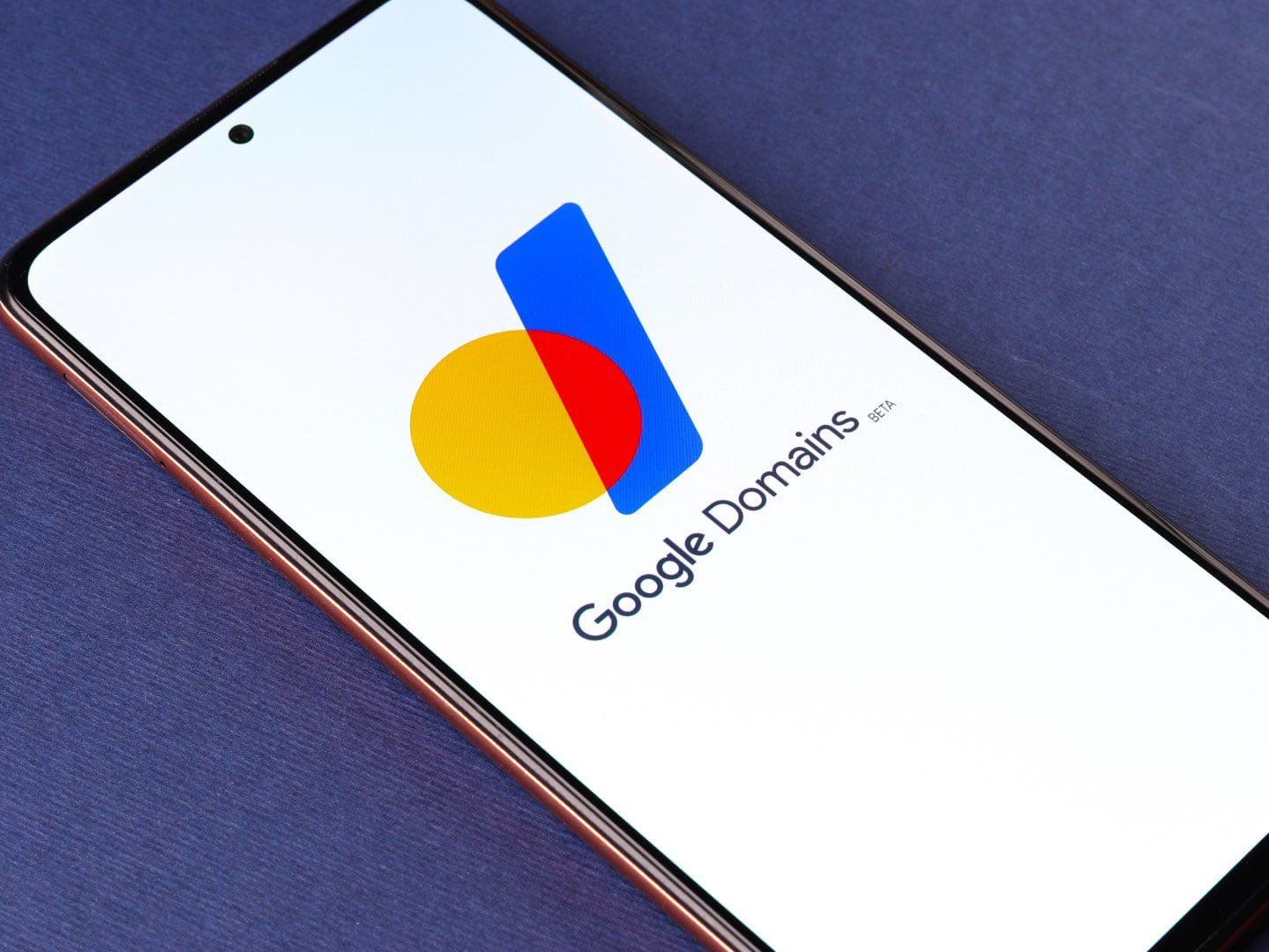 Smartphone displaying Google Domains logo and branding