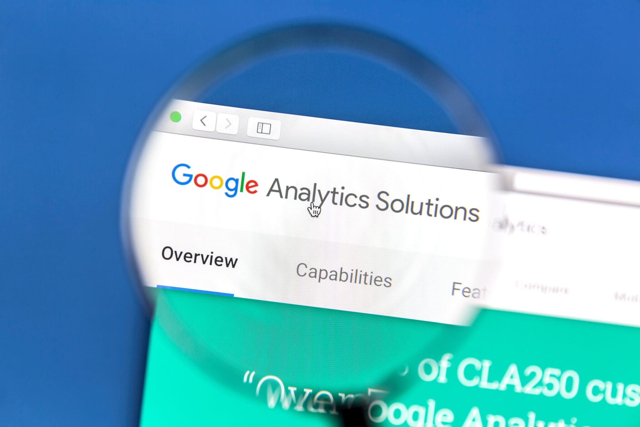Close-up of a web browser showing the Google Analytics Solutions page under a magnifying glass.