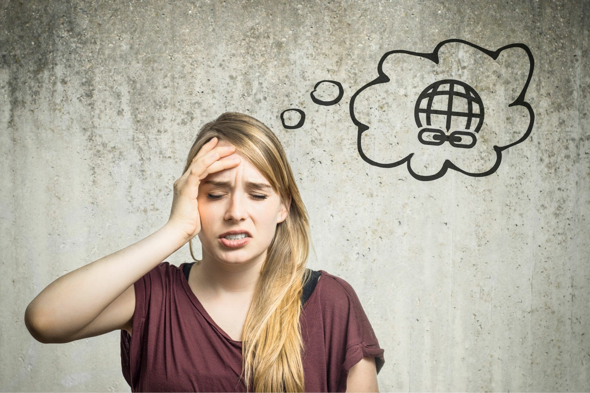 A woman expressing frustration with a thought bubble showing a broken globe symbolising the instability of using Domaincheck for website hosting.