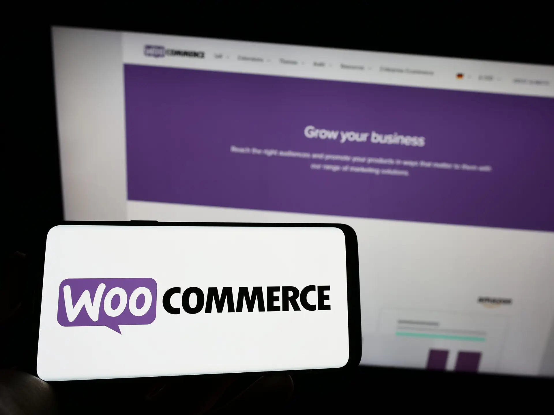 Editorial image of a WooCommerce logo displayed on a computer screen