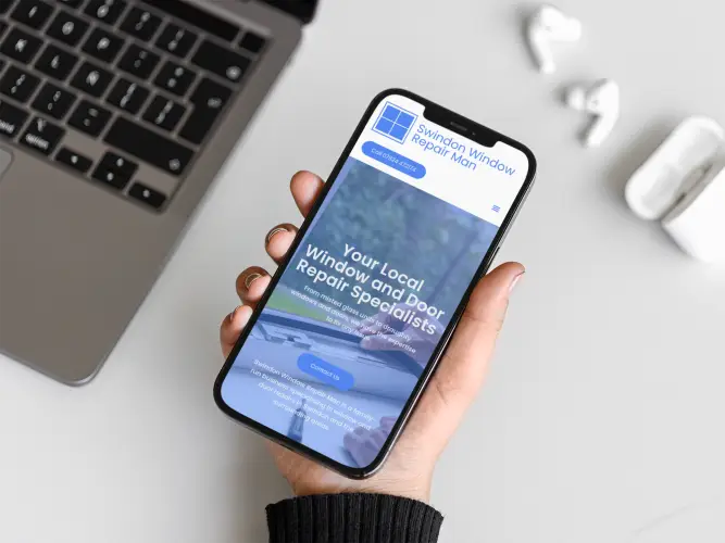 A woman using her iPhone to view the new website for Swindon Window Repair Man, showcasing a mobile-friendly design.