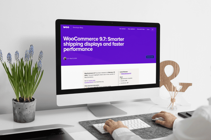 Man working on an iMac with a WooCommerce dashboard on screen