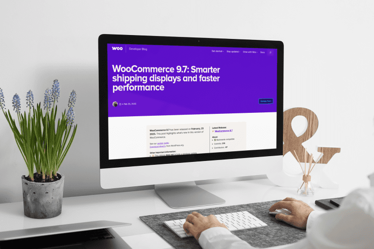 Man working on an iMac with a WooCommerce dashboard on screen